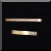 J03. Gold tie clips. 